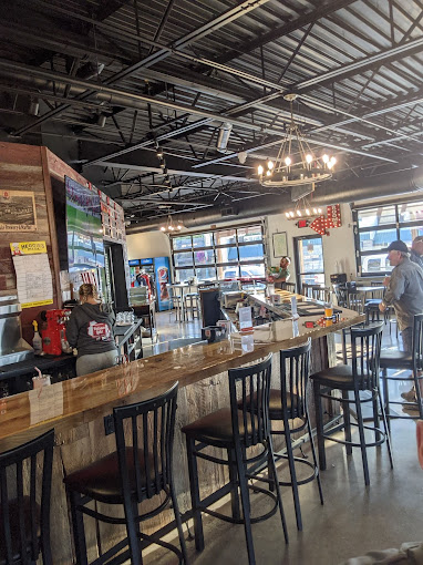 The restaurant has bar stools and tables.