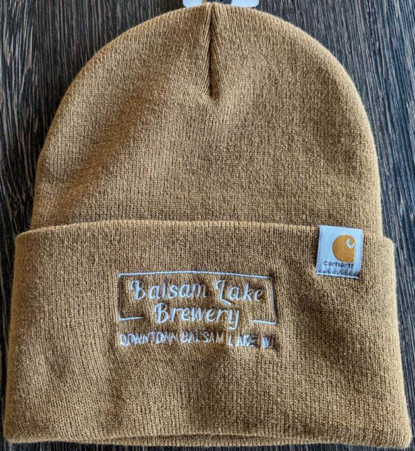 Brown Carhartt Black Winter Cap with "balsam lake brewery downtown balsam lake, wi" embroidered on the front and a carhartt logo on the side.