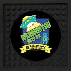 The Bar Coaster Weebenator 4pk logo is featured on a black mat from Balsam Lake Brewery.