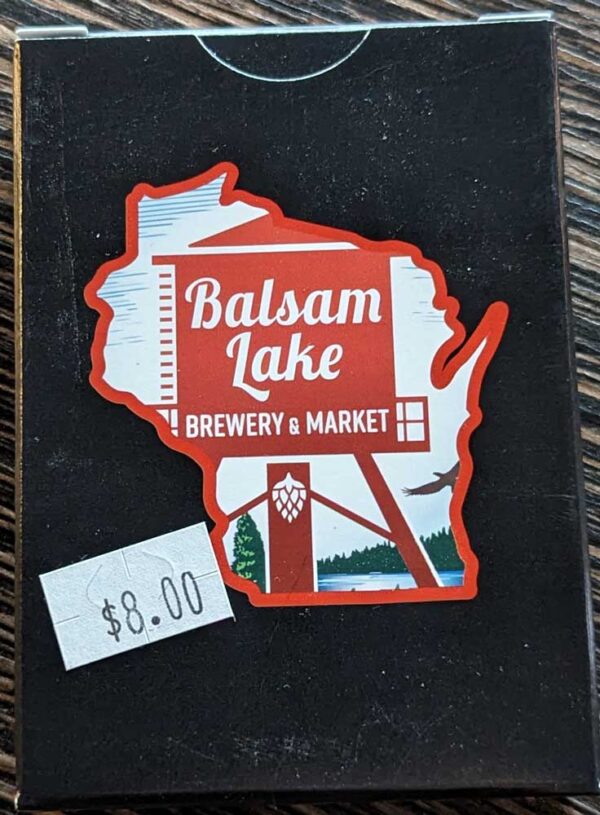A souvenir deck of cards from balsam lake brewery & market with a price tag of $8.00.