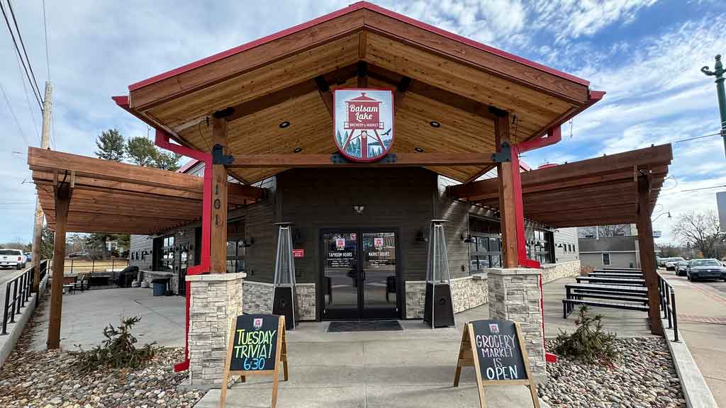Outside look at Balsam Lake Brewery, wooden fram with red pillars