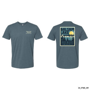 The Indigo Tee W/ Rising Moon features a small "Balsam Lake Brewery Market" logo on the front left chest and a large graphic with the same text, trees, and a moon on the back.